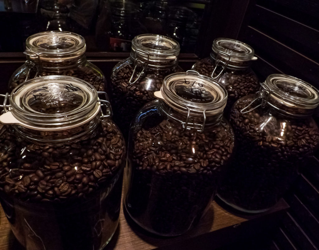 storage jars brimming with coffee beans freshly roasted